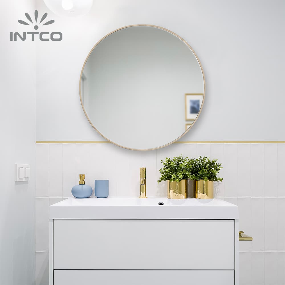 Add a clean modern element to your decor with 27" metal framed round wall mirror